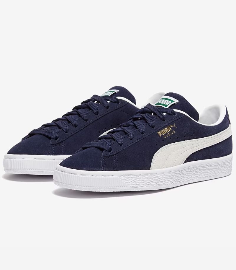 Navy blue puma suede trainers with white sole and branding 